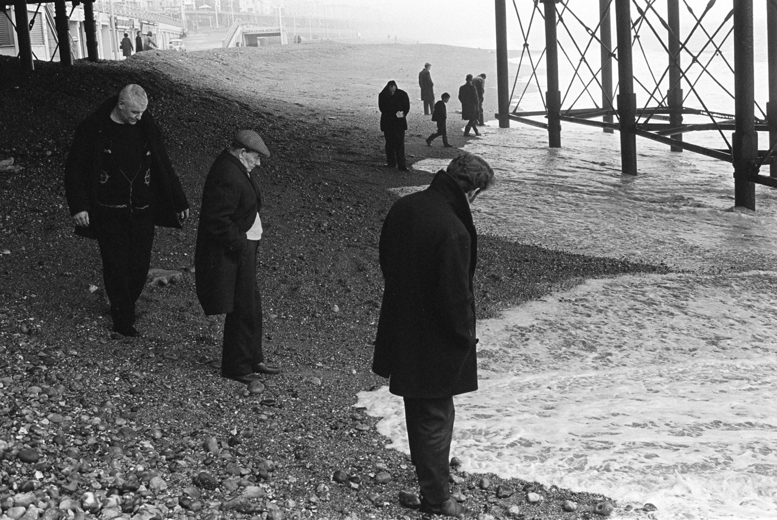Blacksanding, sunday morning, under Brighton Pier looking for coins that are washed up, Brighton, Sussex, 1970