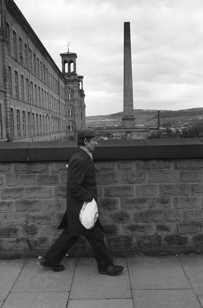 Factory worker going home, Salts Cotton Mill, Saltaire, Yorkshire, 1981