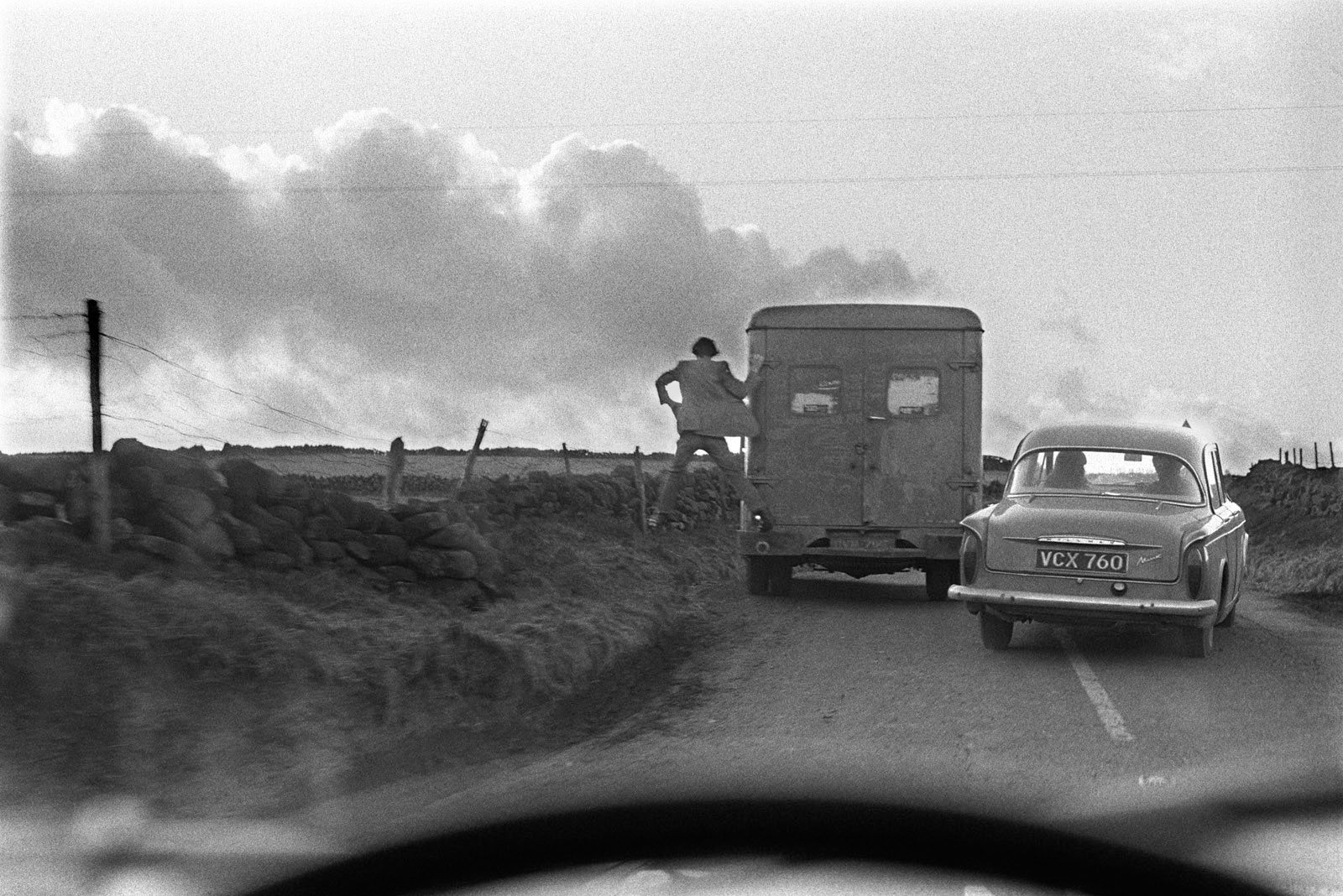 Man jumping off the back of a lorry, 1970