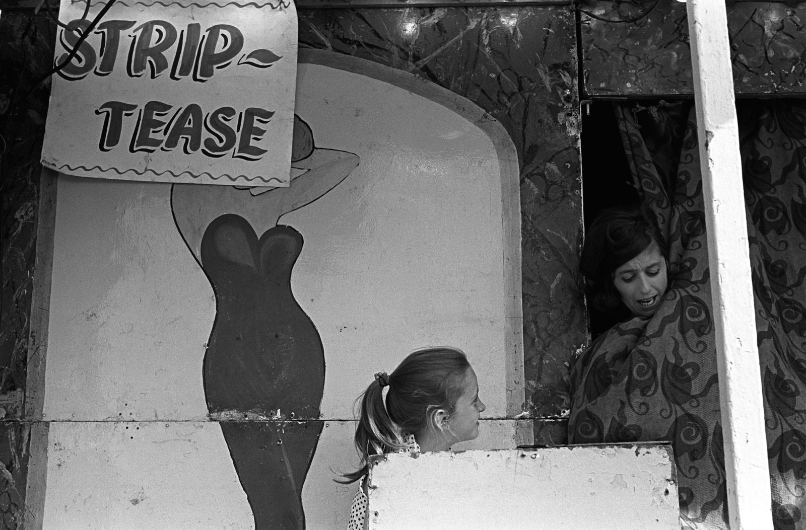 Striptease booth, mother and daughter. Derby Day, Epsom Downs, Surrey, 1969