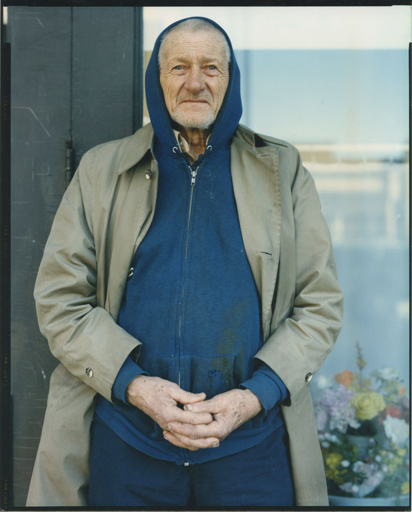 Man in hooded sweatshirt and coat, 1987