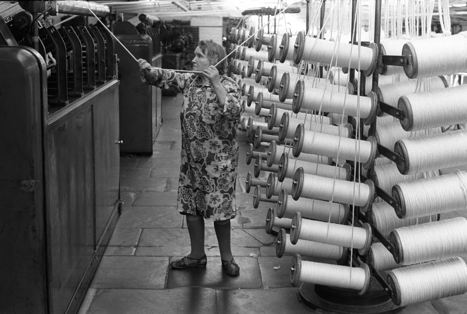 Factory work, woman working in Salts Mill Saltaire Yorkshire, 1981