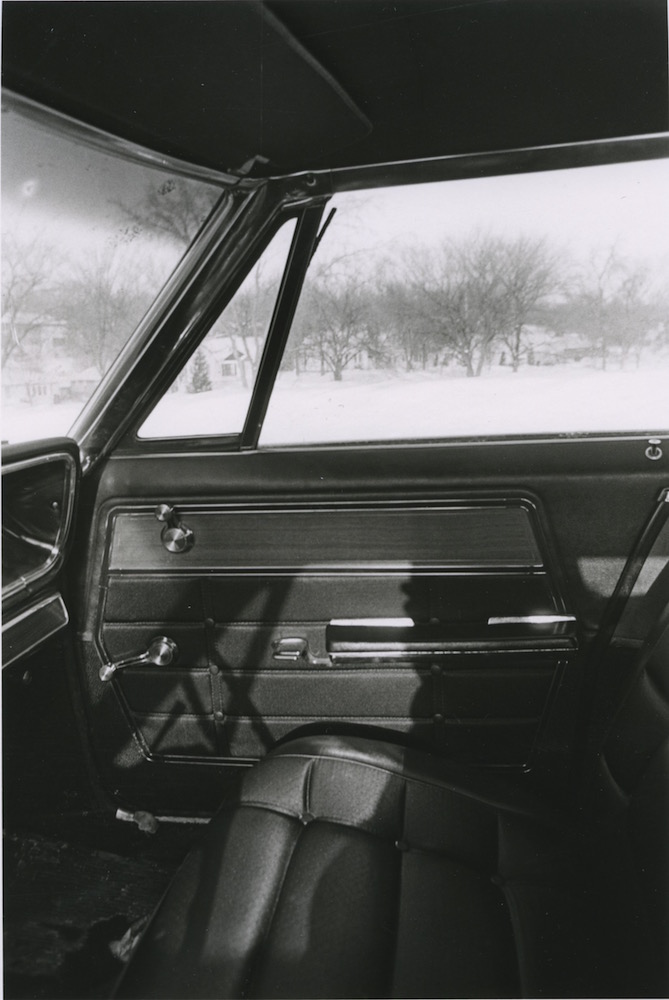 Car interior in winter, 1970